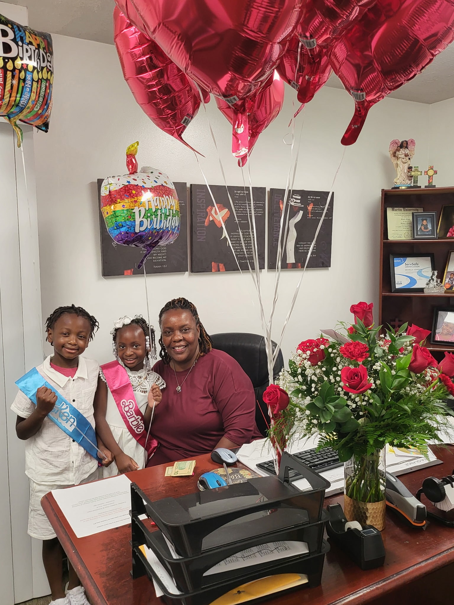 Director Michelle Johnson celebrating with children at Safecare Development
